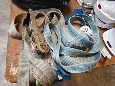 a bag with a pair of shoes and a pair of scissors on a table