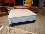 a mattress that is sitting on the floor in a room