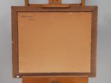 an old wooden easel with a painting on top of it