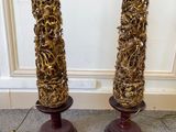 pair of vintage carved wood lamps with brass leaves on bases