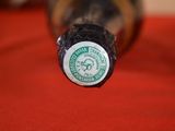 a close up of a bottle of beer on a table