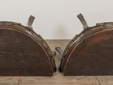 two wooden bookends sitting on the floor next to each other
