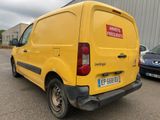 a yellow van that is parked in a parking lot