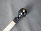 a baseball bat that has a wooden handle on it