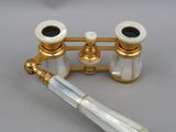 an image of a pair of brass and mother of pearl binoculars