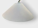 a white lamp that is on a white table