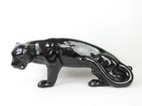 an image of a black cat figurine on a white background