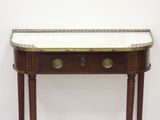 a small table with a marble top on it