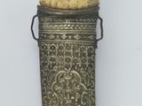 an elephant horn with a metal holder on the wall