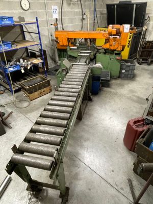 a conveyor belt in the middle of a factory