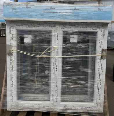 a large window that has been wrapped up on a pallet