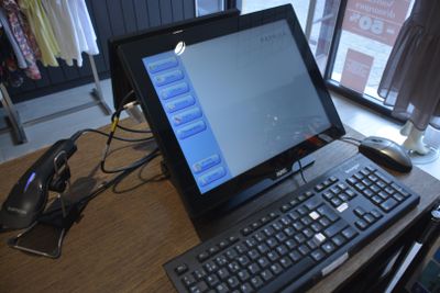 a laptop computer sitting on a desk with a keyboard and mouse