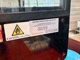 a machine that is sitting on a red table