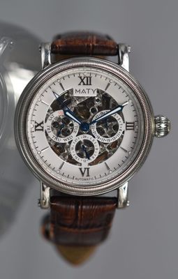 a close up of a wrist watch with a brown strap