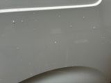 a close up of a car door with a handle on it