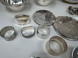 a table that has a lot of silver items on it