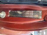 a plaque on the back of a red car