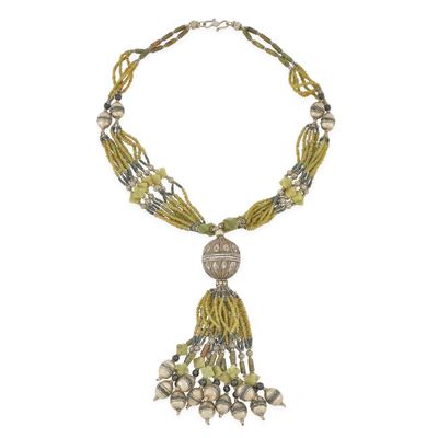 a close up of a necklace on a white background