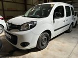 a white van parked in a garage with other cars