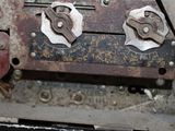 a close up of an old machine with some buttons on it
