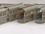 three model trains that are sitting on a table