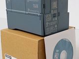 three electronic devices are stacked on top of each other in a box