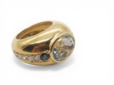 an image of a yellow gold ring with a blue and white diamond