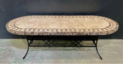 a table that has a tile top on it
