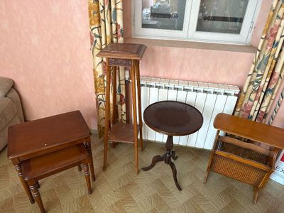 a small table and two chairs in a living room