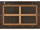 an old wooden frame with four glass panels and metal hardware