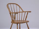 une chaise en bois posée sur une surface blanche