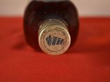 a close up of a bottle of wine on a table