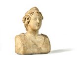 marble bust of a woman with curly hair on a white background