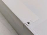 a close up of the back of a white laptop
