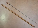 an image of a pair of wooden canes sitting on top of a table