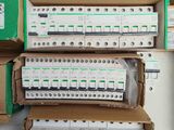 many boxes of electrical equipment stacked on top of each other