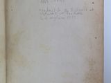 an open book with writing on it sitting on a table