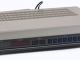 an image of a small electronic device sitting on top of a white surface