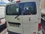 a white van that is parked on the side of the road