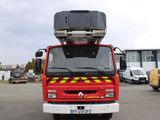 a red fire truck parked in a parking lot