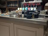 an image of a bar with a stool in front of it