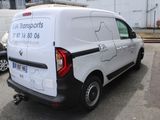 a white van that is parked in a parking lot