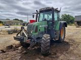 a tractor that is sitting in the dirt