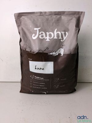 a close up of a bag of dog food sitting on a counter