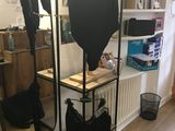 a rack with lingersuits and bras on it in a room