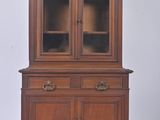 an image of a wooden china cabinet with glass doors