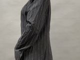 an image of a mannequin wearing a black and white pinstripe suit