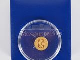 a gold coin in a blue box with a white background