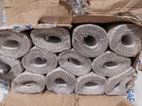 a box full of rolls of toilet paper sitting on a table