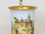 a small vase with a painting of a castle on it